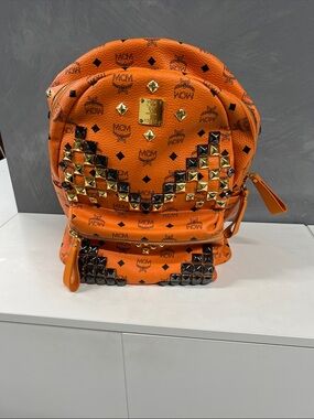 MCM Orange Logo Studded Backpack with Gold Plaque